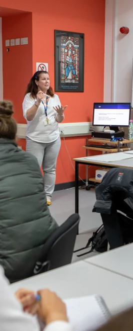 Glasgow Kelvin College students actively participating in class, guided by their lecturer through interactive discussions and activities. Glasgow Kelvin College students actively participating in class, guided by their lecturer through interactive discussions and activities.